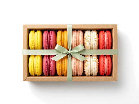 Bright & Fruity — a dozen fruit-flavored French macarons in a kraft box with a sage green ribbon bow