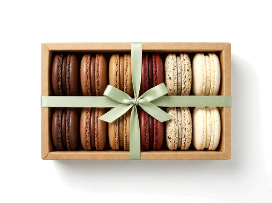 The Chocolate Reserve — a dozen chocolate French macarons in a kraft box with a sage green ribbon bow
