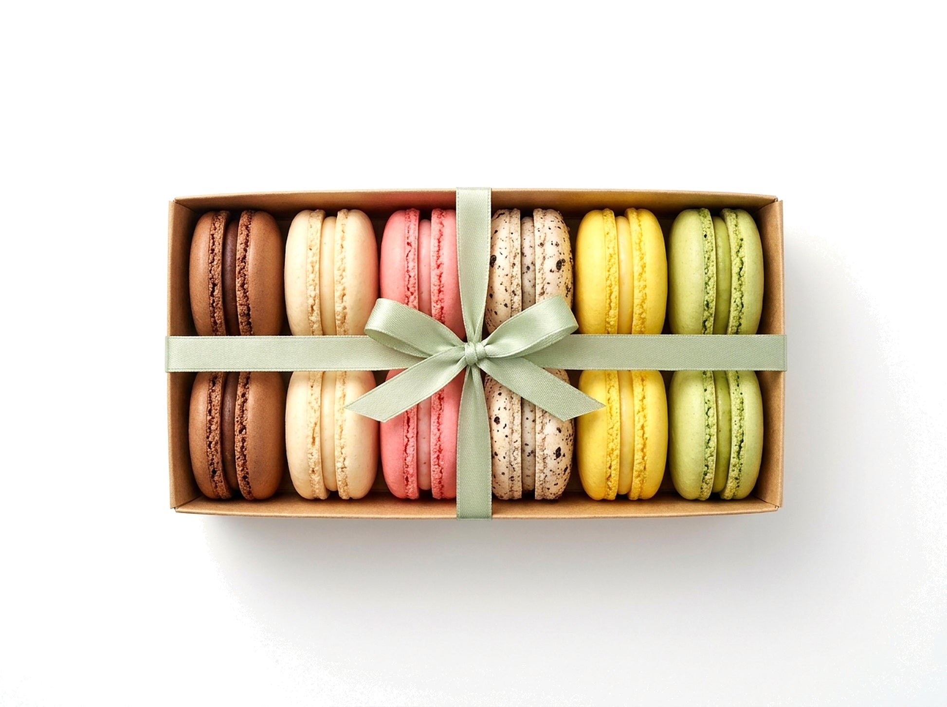 Crowd Favorites — a dozen bestselling French macarons in a kraft box with a sage green ribbon bow